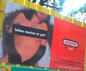 Advertising for a auto junkyard seen on a garbage truck near the Reeperbahn in Hamburg.